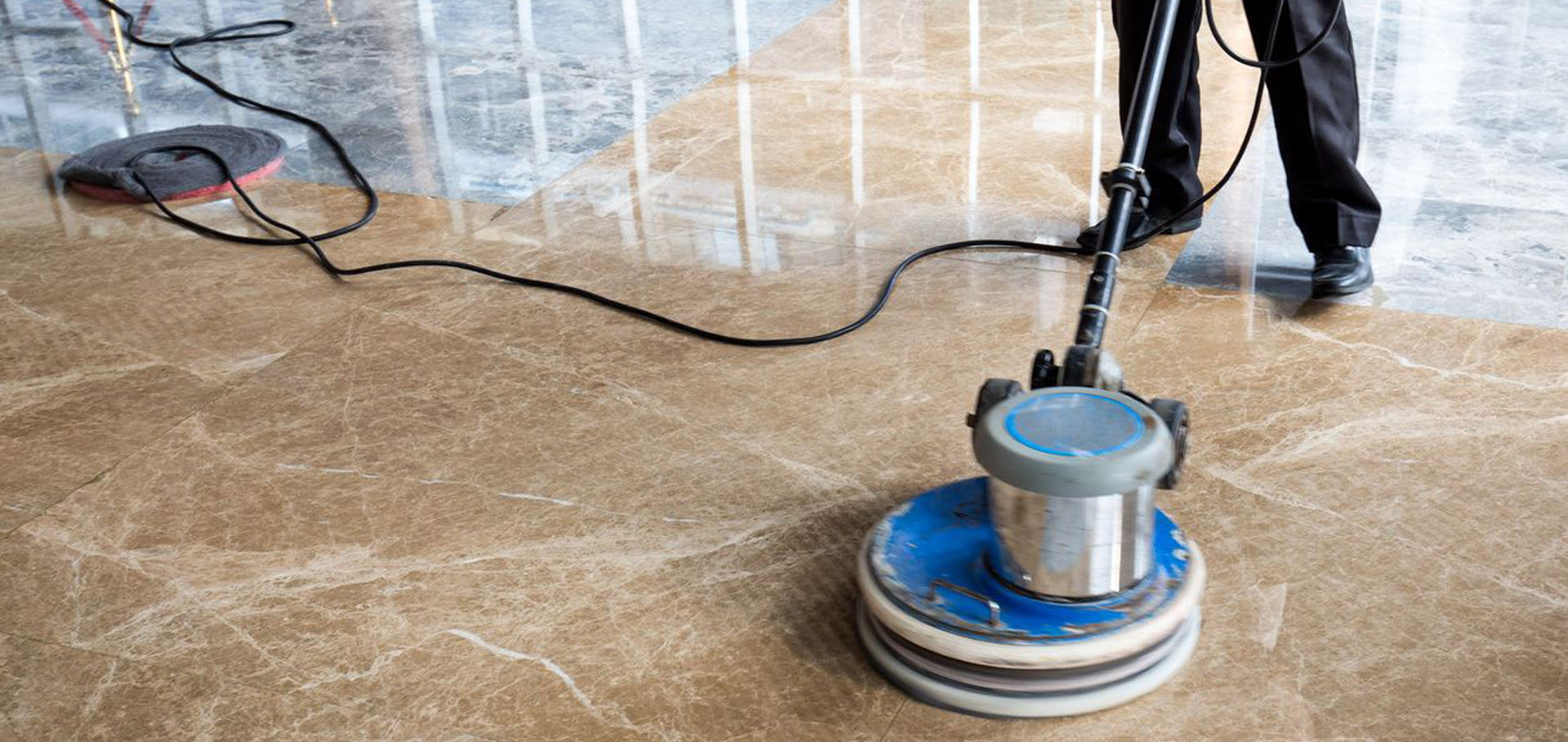 A floor cleaning machine is on the ground.